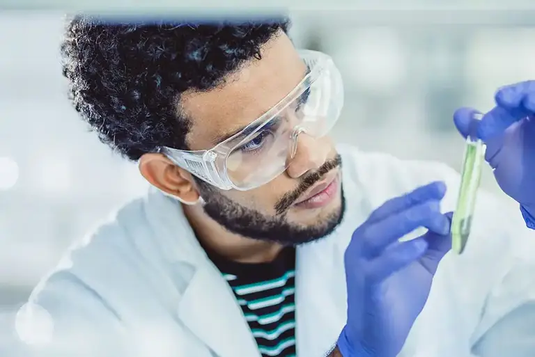 Scientist with vial